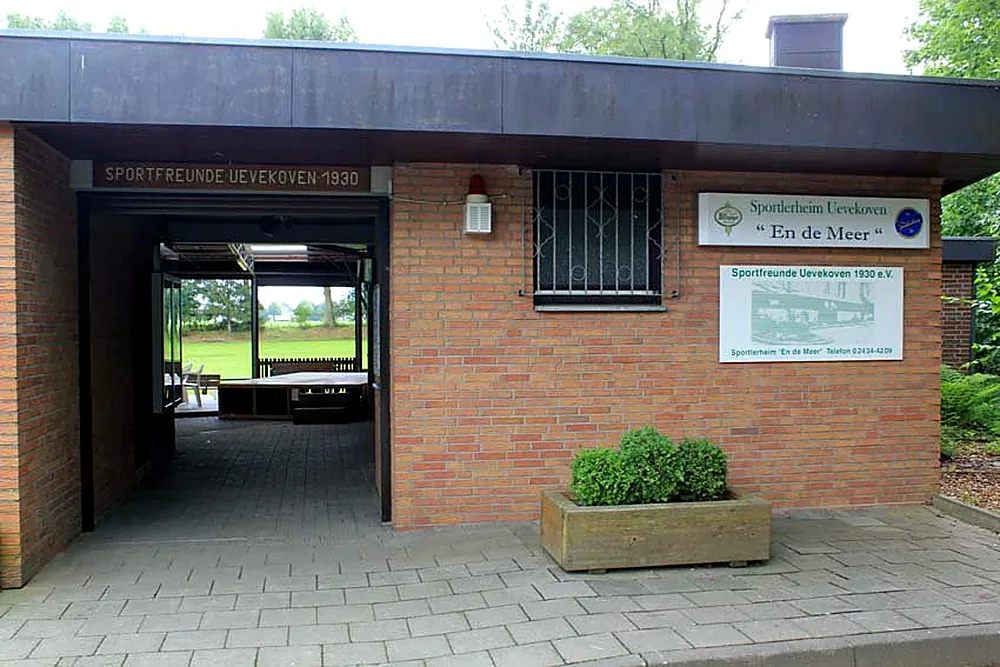 Clubhouse entrance with the way through to the pitch
